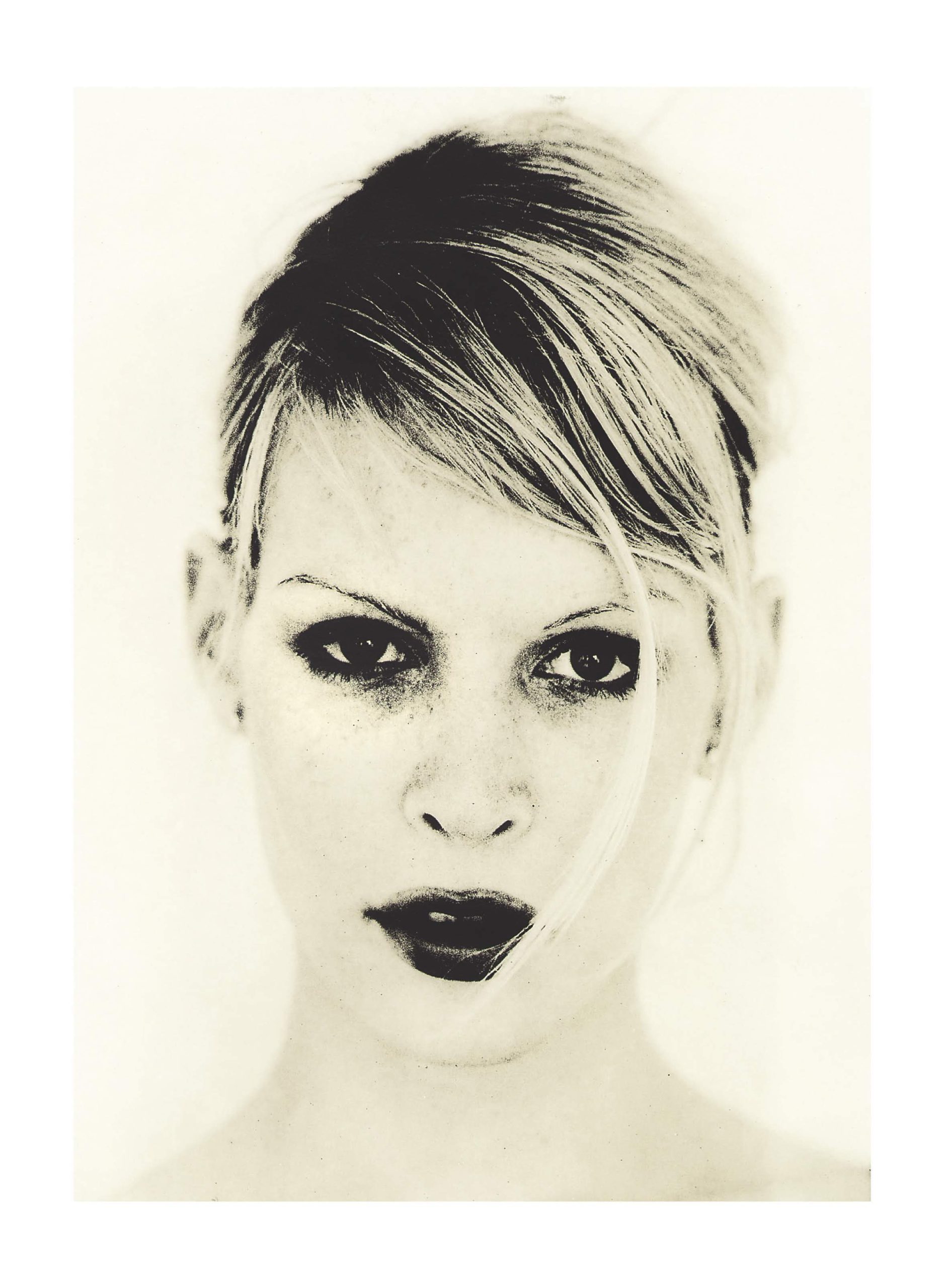 Analog lith print portraits of young woman lookinag at camera. Vertical studio shot.